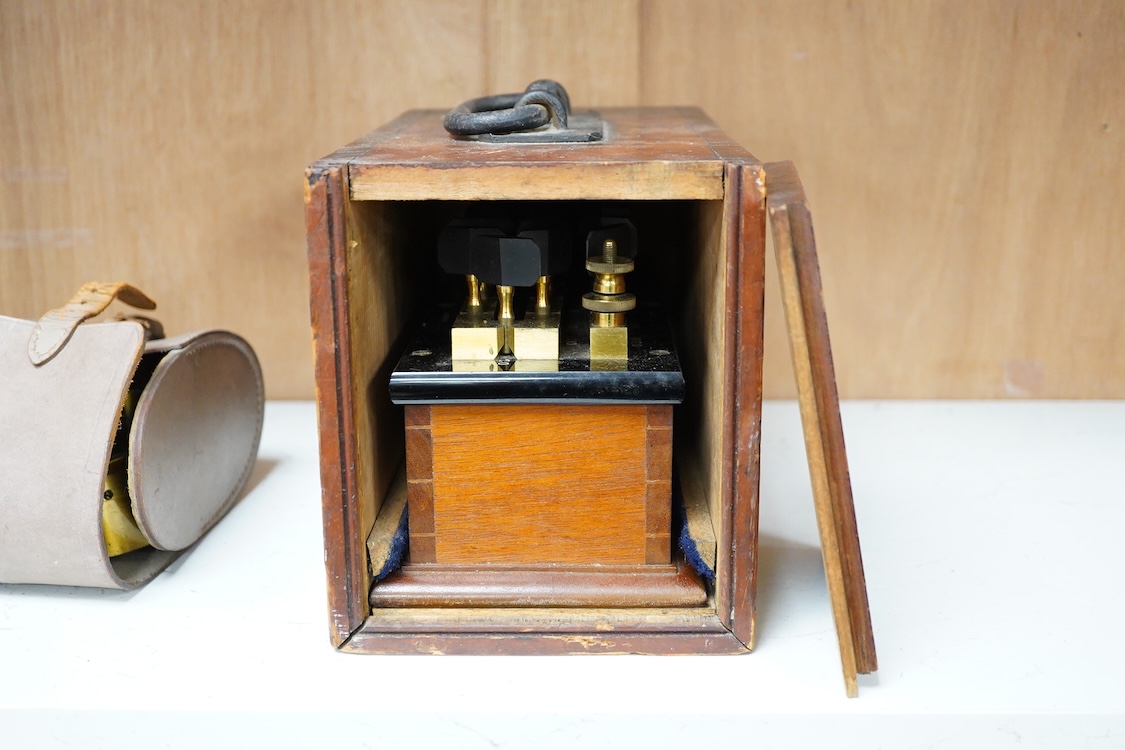 An early 20th century mahogany cased Wheatstone Bridge by C.J. Simmons, London, intended to measure electrical resistance, the case dimensions; 26cm x 14cm x 16.5cm, together with a leather cased brass Galvanometer, inte